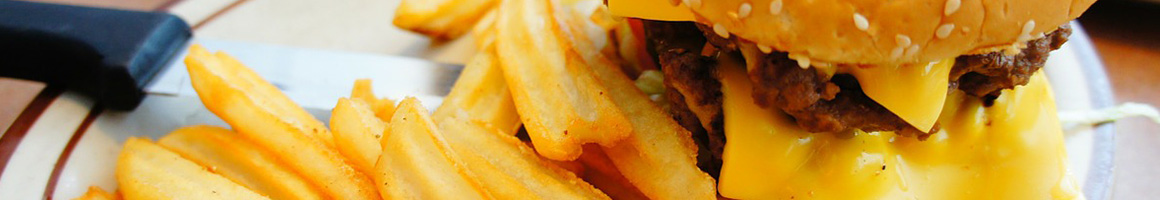 Eating Burger Fast Food at So-Cal Burgers restaurant in Los Angeles, CA.
